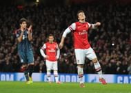 Mesut Ozil reacts after missing the penalty against Bayern Munich in Arsenal's 0-2 defeat at the Emirates